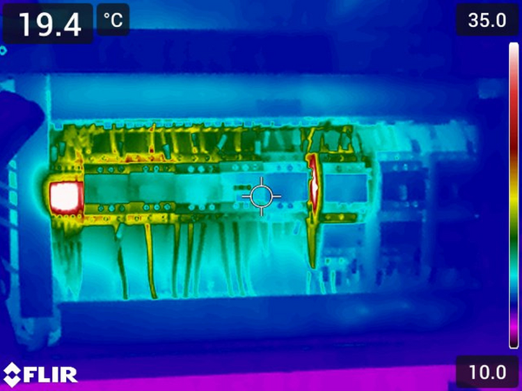Thermal imaging readout showing heat signatures across an electrical panel